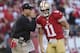 SAN FRANCISCO, CA - SEPTEMBER 16: Head coach Jim Harbaugh of the San Francisco 49ers gives his quarterback Alex Smith a play to run in the second quarter against the Detroit Lions at Candlestick Park on September 16, 2012 in San Francisco, California. (Photo by Thearon W. Henderson/Getty Images)