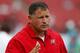 TAMPA, FL - SEPTEMBER 09: Head coach Greg Schiano of the Tampa Bay Buccaneers talks with the players at warmups just before the start of the game against the Carolina Panthers during the season opening NFL game at Raymond James Stadium on September 9, 2012 in Tampa, Florida. (Photo by J. Meric/Getty Images)