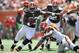 CINCINNATI, OH - SEPTEMBER 16: Trent Richardson #33 of the Cleveland Browns sidesteps the tackle attempt of Rey Maualuga #58 of the Cincinnati Bengals en route to a big gain in the first half at Paul Brown Stadium on September 16, 2012 in Cincinnati, Ohio. (Photo by Jamie Sabau/Getty Images)