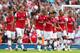 LONDON, ENGLAND - SEPTEMBER 15: Arsenal players celebrate after Nathaniel Clyne of Southhampton scores an own goal to make it 4-0 in the first half during the Barclays Premier League match between Arsenal and Southampton at Emirates Stadium on September 15, 2012 in London, England. (Photo by Clive Mason/Getty Images)