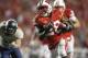 MADISON, WI - SEPTEMBER 15: Running back Montee Ball #28 of the Wisconsin Badgers breaks through the Utah State Aggies defense for a touchdown in the third quarter September 15, 2012 at Camp Randall Stadium in Madison, Wisconsin. (Photo by Tom Lynn/Getty Images)