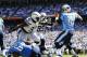 September 16, 2012; San Diego, CA, Tennessee Titans quarterback Jake Locker (10) passes the ball before being hit by San Diego Chargers defensive tackle Cam Thomas (93) during the second quarter against the San Diego Chargers at Qualcomm Stadium. Mandatory Credit: Christopher Hanewinckel-US PRESSWIRE