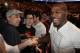 May 5, 2012; East Rutherford, NJ, USA; Jon Jones (far right) shakes hands with fans during the middleweight bout between Alan Belcher and Rousimar Palhares during UFC on Fox 3 at the Izod Center. Mandatory Credit: Joe Camporeale-US PRESSWIRE