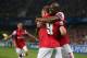 MONTPELLIER, FRANCE - SEPTEMBER 18: Abou Diaby of Arsenal congratulates Lukas Podolski of Arsenal celebrates scoring his teams first goal during the UEFA Champions League match between Montpellier Herault SC and Arsenal at Stade de la Mosson on September 18, 2012 in Montpellier, France. (Photo by Julian Finney/Getty Images)