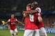 MONTPELLIER, FRANCE - SEPTEMBER 18: Abou Diaby of Arsenal congratulates Lukas Podolski of Arsenal celebrates scoring his teams first goal during the UEFA Champions League match between Montpellier Herault SC and Arsenal at Stade de la Mosson on September 18, 2012 in Montpellier, France. (Photo by Julian Finney/Getty Images)
