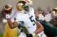 EAST LANSING, MI - SEPTEMBER 15: Everett Golson #5 of the Notre Dame Fighting Irish throws a third quarter pass as he is hit while playing the Michigan State Spartans at Spartan Stadium Stadium on September 15, 2012 in East Lansing, Michigan. Notre Dame won the game 20-3. (Photo by Gregory Shamus/Getty Images)