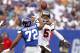 EAST RUTHERFORD, NJ - SEPTEMBER 16: Josh Freeman #5 of the Tampa Bay Buccaneers passes over Osi Umenyiora #72 of the New York Giants during a game at MetLife Stadium on September 16, 2012 in East Rutherford, New Jersey. (Photo by Jeff Zelevansky/Getty Images)