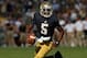 SOUTH BEND, IN - SEPTEMBER 08: Everett Golson #5 of the Notre Dame Fighting Irish rolls out to look for a receiver against the Purdue Boilermakers at Notre Dame Stadium on September 8, 2012 in South Bend, Indiana. Notre Dame defeated Purdue 21-17. (Photo by Jonathan Daniel/Getty Images)