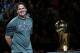 DALLAS, TX - DECEMBER 25: Owner Mark Cuban of the Dallas Mavericks stands with the NBA trophy before a game against the Miami Heat on opening day of the NBA season at American Airlines Center on December 25, 2011 in Dallas, Texas. NOTE TO USER: User expressly acknowledges and agrees that, by downloading and/or using this Photograph, user is consenting to the terms and conditions of the Getty Images License Agreement. (Photo by Ronald Martinez/Getty Images)