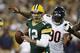 GREEN BAY, WI - SEPTEMBER 13: Aaron Rodgers #12 of the Green Bay Packers looks to pass the football while under pressure from Julius Peppers #90 of the Chicago Bears during first half play at Lambeau Field on September 13, 2012 in Green Bay, Wisconsin. (Photo by Joe Robbins/Getty Images)