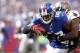 EAST RUTHERFORD, NJ - SEPTEMBER 16: Hakeem Nicks #88 of the New York Giants tries to break the tackle of Aqib Talib #25 of the Tampa Bay Buccaneers during a game at MetLife Stadium on September 16, 2012 in East Rutherford, New Jersey. (Photo by Jeff Zelevansky/Getty Images)