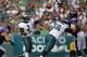 PHILADELPHIA, PA - SEPTEMBER 16: Quarterback Michael Vick #7 of the Philadelphia Eagles makes a pass as teammate Dallas Reynolds #66 blocks Maake Kemoeatu #96 of the Baltimore Ravens as Haloti Ngata #92 close in during a game at Lincoln Financial Field on September 16, 2012 in Philadelphia, Pennsylvania. The Eagles defeated the Ravens 24-23. (Photo by Rich Schultz /Getty Images)