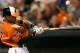 BALTIMORE, MD - SEPTEMBER 08: Adam Jones #10 of the Baltimore Orioles breaks his bat while popping up for the third out of the third inning against the New York Yankees at Oriole Park at Camden Yards on September 8, 2012 in Baltimore, Maryland. (Photo by Rob Carr/Getty Images)