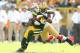 GREEN BAY, WI - SEPTEMBER 09: Greg Jennings #85 of the Green Bay Packers runs with the ball while defended by Patrick Willis #52 of the San Francisco 49ers during the NFL season opener at Lambeau Field on September 9, 2012 in Green Bay, Wisconsin. (Photo by Andy Lyons/Getty Images)