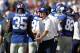 EAST RUTHERFORD, NJ - SEPTEMBER 16: Head coach Tom Coughlin greets Andre Brown #35 of the New York Giants during a game against the Tampa Bay Buccaneers at MetLife Stadium on September 16, 2012 in East Rutherford, New Jersey. (Photo by Jeff Zelevansky/Getty Images)