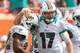 MIAMI GARDENS, FL - SEPTEMBER 16: Ryan Tannehill #17 congratulates Reggie Bush #22 of the Miami Dolphins after a touchdown during a game against the Oakland Raiders at Sun Life Stadium on September 16, 2012 in Miami Gardens, Florida. (Photo by Mike Ehrmann/Getty Images)