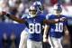 EAST RUTHERFORD, NJ - SEPTEMBER 16: Victor Cruz #80 of the New York Giants celebrates a touchdown against the Tampa Bay Buccaneers during a game at MetLife Stadium on September 16, 2012 in East Rutherford, New Jersey. (Photo by Jeff Zelevansky/Getty Images)