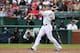 Josh Hamilton follows the trajectory of his hit.