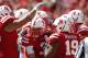 Sep 15, 2012; Lincoln, NE, USA; Nebraska Cornhuskers quarterback Taylor Martinez (3) is congratulated by his teammates after scoring a touchdown against Arkansas State Red Wolves at Memorial Stadium in the second half. Nebraska won 42-13. Mandatory Credit: Bruce Thorson-US PRESSWIRE