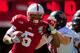 LINCOLN, NE - SEPTEMBER 15: Running back Braylon Heard #5 of the Nebraska Cornhuskers gets past defensive back Artez Brown #10 of the Arkansas State Red Wolves during their game at Memorial Stadium on September 15, 2012 in Lincoln, Nebraska. (Photo by Eric Francis/Getty Images)