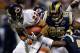 ST. LOUIS, MO - NOVEMBER 23: Matt Forte #22 of the Chicago Bears rushes against Clifton Ryan #95 of the St. Louis Rams at the Edward Jones Dome on November 23, 2008 in St. Louis, Missouri. The Bears beat the Rams 27-3. (Photo by Dilip Vishwanat/Getty Images)