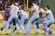 ARLINGTON, TX - AUGUST 11: Mike Olt #9 of the Texas Rangers is congratulated by his teammates for hitting a walk off single for the win against the Detroit Tigers at Rangers Ballpark in Arlington on August 11, 2012 in Arlington, Texas. (Photo by Rick Yeatts/Getty Images)