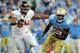 PASADENA, CA - NOVEMBER 06: Derrick Coleman #33 of the UCLA Bruins runs from Stephen Paea #54 of the Oregon State Beavers at the Rose Bowl on November 6, 2010 in Pasadena, California. (Photo by Harry How/Getty Images)