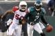 November 13, 2011; Philadelphia, PA, USA; Philadelphia Eagles quarterback Michael Vick scrambles away from Arizona Cardinals defender O'Brien Schofield during third quarter action at Lincoln Financial Field. Mandatory Credit: Jeffrey G. Pittenger-US PRESSWIRE