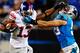 CHARLOTTE, NC - SEPTEMBER 20: Ramses Barden #13 of the New York Giants stiff-arms Luke Kuechly #59 of the Carolina Panthers during play at Bank of America Stadium on September 20, 2012 in Charlotte, North Carolina. (Photo by Grant Halverson/Getty Images)