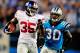 CHARLOTTE, NC - SEPTEMBER 20: Andre Brown #35 of the New York Giants breaks away from Charles Godfrey #30 of the Carolina Panthers for a long gain during play at Bank of America Stadium on September 20, 2012 in Charlotte, North Carolina. (Photo by Grant Halverson/Getty Images)