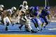 BOISE, ID - SEPTEMBER 20: Michael Alisa #42 of the BYU Cougars tries to evade a tackle by Samuel Ukwuachu #82 of the Boise State Broncos at Bronco Stadium on September 20, 2012 in Boise, Idaho. (Photo by Otto Kitsinger III/Getty Images)