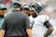 PHILADELPHIA, PA - SEPTEMBER 16: Quarterback Michael Vick #7 of the Philadelphia Eagles listens to special teams coach Duce Staley (L) and head coach Andy Reid during a timeout in a game against the Baltimore Ravens at Lincoln Financial Field on September 16, 2012 in Philadelphia, Pennsylvania. The Eagles defeated the Ravens 24-23. (Photo by Rich Schultz /Getty Images)