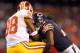 Aug 18, 2012; Chicago, IL, USA; Chicago Bears cornerback Tim Jennings (26) tackles Washington Redskins wide receiver Pierre Garcon (88) during the second quarter at Soldier Field. Mandatory Credit: Dennis Wierzbicki-US PRESSWIRE
