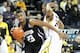 March 3, 2012; Iowa City, IA, USA; Northwestern Wildcats guard JerShon Cobb (23) gets fouled by Iowa Hawkeyes guard Bryce Cartwright (24) at Carver Hawkeye Arena. Northwestern beat Iowa 70-66. Mandatory Credit: Reese Strickland-US PRESSWIRE