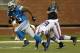 DETROIT, MI - AUGUST 30: Mikel Leshoure #25 of the Detroit Lions gets around the tackle of Arthur Moats #52 of the Buffalo Bills after a first quarter catch during a pre season game at Ford Field on August 30, 2012 in Detroit, Michigan. (Photo by Gregory Shamus/Getty Images)