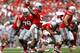 COLUMBUS, OH - SEPTEMBER 1: Kent Kern #43 of the Miami Redhawks hits Braxton Miller #5 of the Ohio State Buckeyes as he throws the ball downfield during the second quarter on September 1, 2012 at Ohio Stadium in Columbus, Ohio. (Photo by Kirk Irwin/Getty Images)