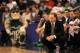 PHOENIX, AZ - MARCH 22: Head coach Tom Izzo of the Michigan State Spartans kneels in front of his team's bench in the first half while taking on the Louisville Cardinals during the 2012 NCAA Men's Basketball West Regional Semifinal game at US Airways Center on March 22, 2012 in Phoenix, Arizona. (Photo by Jamie Squire/Getty Images)