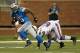 DETROIT, MI - AUGUST 30: Mikel Leshoure #25 of the Detroit Lions gets around the tackle of Arthur Moats #52 of the Buffalo Bills after a first quarter catch during a pre season game at Ford Field on August 30, 2012 in Detroit, Michigan. (Photo by Gregory Shamus/Getty Images)