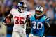 CHARLOTTE, NC - SEPTEMBER 20: Andre Brown #35 of the New York Giants breaks away from Charles Godfrey #30 of the Carolina Panthers for a long gain during play at Bank of America Stadium on September 20, 2012 in Charlotte, North Carolina. (Photo by Grant Halverson/Getty Images)