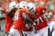 MIAMI GARDENS, FL - SEPTEMBER 15: Anthony Chickillo #71 is congratulated by Shayon Green #51 and Kelvin Cain #94 of the Miami Hurricanes after intercepting a pass against the Bethune-Cookman Wildcats on September 15, 2012 at Sun Life Stadium in Miami Gardens, Florida. The Hurricanes defeated the Wildcats 38-10. (Photo by Joel Auerbach/Getty Images)
