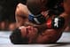 September 22, 2012; Toronto, ON, CANADA; Vitor Belfort (bottom) battles Jon Jones in the light heavyweight championship during UFC 152 at the Air Canada Centre. Mandatory Credit: Tom Szczerbowski-US PRESSWIRE
