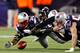 FOXBORO, MA - JANUARY 22: Emanuel Cook #37 of the Baltimore Ravens fights for a fumbled ball with Dane Fletcher #52 and Lousaka Polite #36 of the New England Patriots in the third quarter during their AFC Championship Game at Gillette Stadium on January 22, 2012 in Foxboro, Massachusetts. (Photo by Rob Carr/Getty Images)