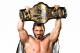 Austin Aries holds up his TNA Heavyweight belt to the camera. (Photo credit: impactwrestling.com)