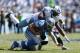 NASHVILLE, TN - SEPTEMBER 23: Akeem Ayers #56 of the Tennessee Titans makes a tackle against Matthew Stafford #9 of the Detroit Lions during the game at LP Field on September 23, 2012 in Nashville, Tennessee. (Photo by Joe Robbins/Getty Images)