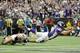 MINNEAPOLIS, MN - SEPTEMBER 23: Dashon Goldson #38 of the San Francisco 49ers attempts to tackle Christian Ponder #7 of the Minnesota Vikings as Ponder scores a touchdown during the second quarter of their game on September 23, 2012 at Mall of America Field at the Hubert H. Humphrey Metrodome in Minneapolis, Minnesota. (Photo by Hannah Foslien/Getty Images)