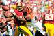 September 23, 2012; Landover, MD, USA; Washington Redskins quarterback Robert Griffin III (10) fumbles after being hit by Cincinnati Bengals defensive end Carlos Dunlap (96) during the second quarter at FedEx Field. Mandatory Credit: Dale Zanine-US PRESSWIRE