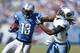 NASHVILLE, TN - SEPTEMBER 23: Nate Burleson #13 of the Detroit Lions runs after a reception against Michael Griffin #33 of the Tennessee Titans during the game at LP Field on September 23, 2012 in Nashville, Tennessee. The Titans won 44-41 in overtime. (Photo by Joe Robbins/Getty Images)