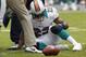 Sept 23, 2012; Miami Gardens, FL, USA; Miami Dolphins running back Reggie Bush (22) injured in the second quarter against the New York Jets at Sun Life Stadium. Mandatory Credit: Robert Mayer-US PRESSWIRE