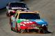 LOUDON, NH - SEPTEMBER 23: Kyle Busch, driver of the #18 M&M's Toyota, leads Jeff Gordon, driver of the #24 Drive to End Hunger Chevrolet, during the NASCAR Sprint Cup Series SYLVANIA 300 at New Hampshire Motor Speedway on September 23, 2012 in Loudon, New Hampshire. (Photo by Jamie Squire/Getty Images)