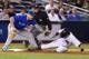 NEW YORK, NY - SEPTEMBER 19: Ichiro Suzuki #31 of the New York Yankees steals third base as Brett Lawrie #13 of the Toronto Blue Jays is late with the tag during their game on September 19, 2012 at Yankee Stadium in the Bronx borough of New York City (Photo by Al Bello/Getty Images)